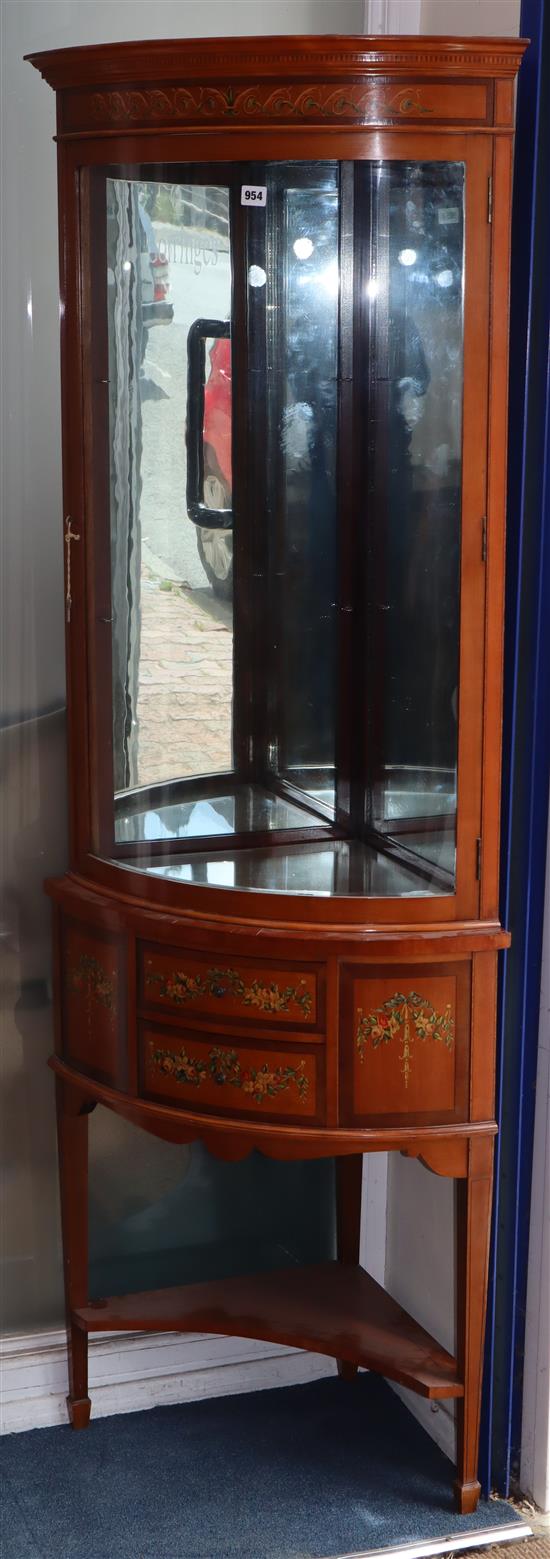 An Edwardian Sheraton revival floral painted satinwood corner display cabinet H.182cm